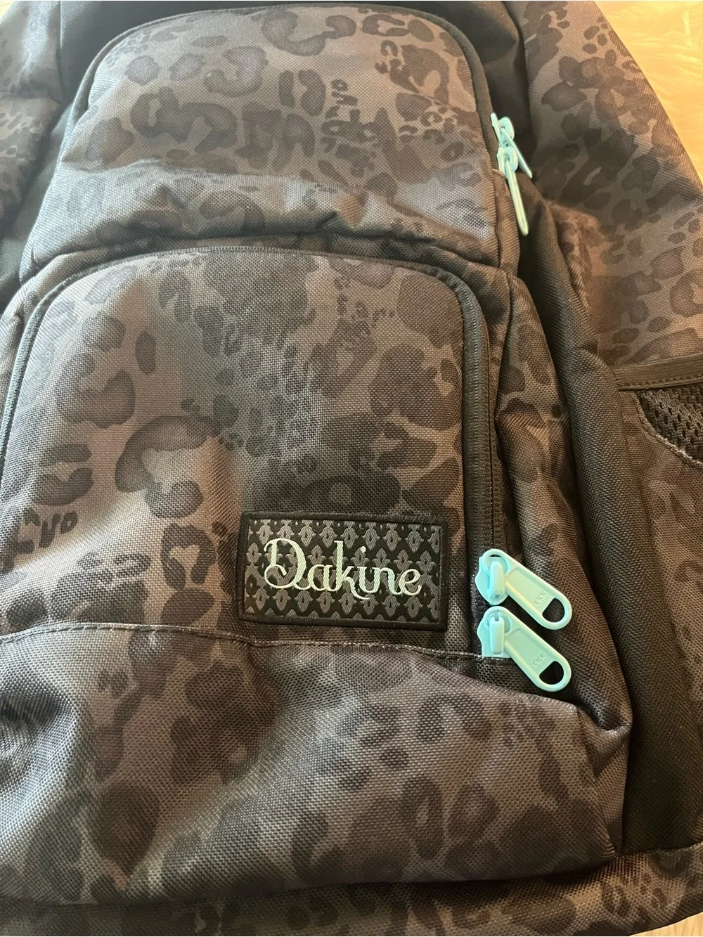 Dakine Black Leopard-Print Backpack with Teal Zipper Accents